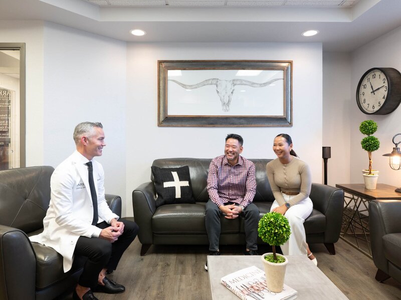 Dr. Broadbent meeting with patients in comfortable lounge setting
