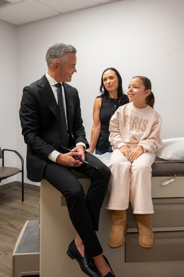 Dr. Ryon Parker MD MBA with mother and daughter during pediatric visit at Parker Medical Las Vegas